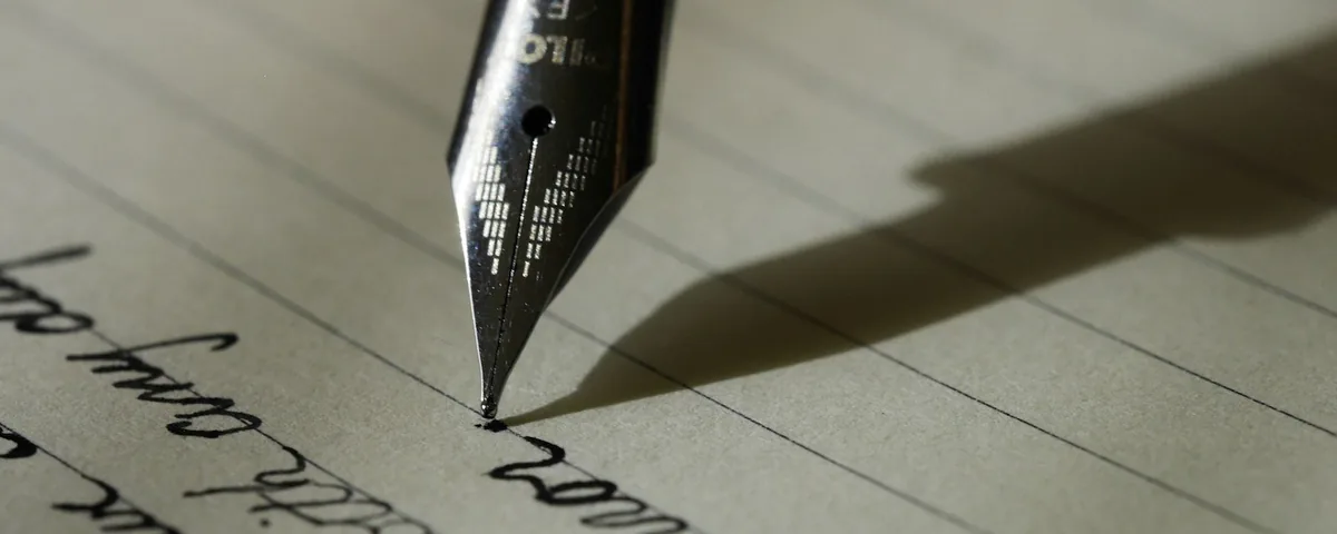 A fountain pen writing on paper